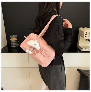 Pink PU leather bowling shoulder bag with cute bow detail and plush cloud charm pendant.