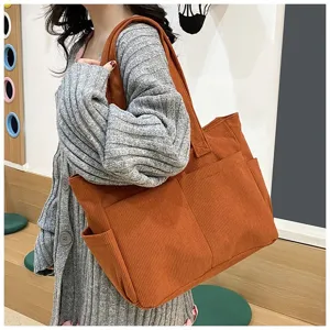 Large capacity corduroy tote bag casual shoulder handbag for daily commuting and school use.