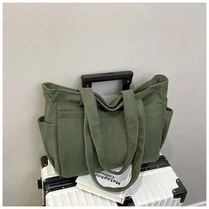 Green corduroy tote bag for women, large capacity shoulder handbag for daily college student use.