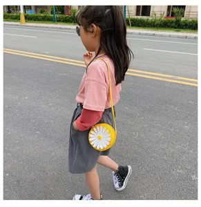 Cute yellow round kids PU crossbody bag with white daisy detail, perfect for children.