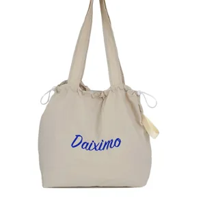 Casual beige canvas tote bag with drawstring closure, large capacity daily shoulder bag.