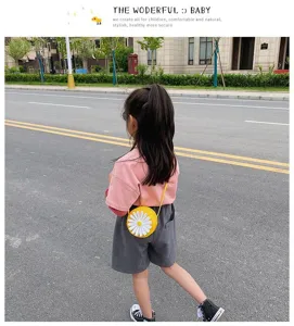 Children cute yellow round daisy cross-body bag detail view, casual outdoor style accessory.
