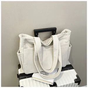 Casual beige corduroy tote bag for women, large capacity shoulder handbag for daily use.