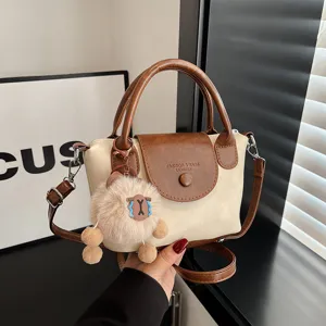 Stylish minimalist handbag for women, retro contrast color crossbody bag with cute plush pendant.