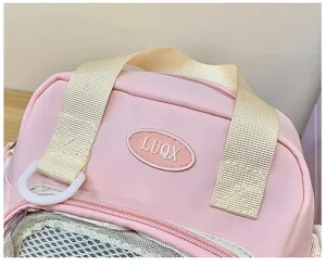 Pink nylon ita bag detail view, sweet style shoulder bag with clear mesh window and handles.