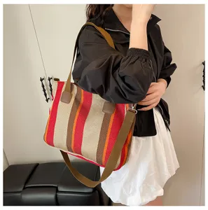 Stylish striped canvas tote bag for women, versatile shoulder and crossbody bag for daily commuting.