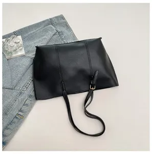 Minimalist black PU leather tote bag for women, large capacity stylish shoulder handbag.