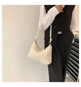 White pleated shoulder bag detail, stylish cloud underarm bag for women, trendy daily accessory.