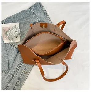 Retro minimalist brown large capacity tote bag with matching inner pouch for daily commuting.
