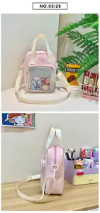 Detail shot of pink Japanese style ita bag with clear window, nylon cross-body strap and handles.