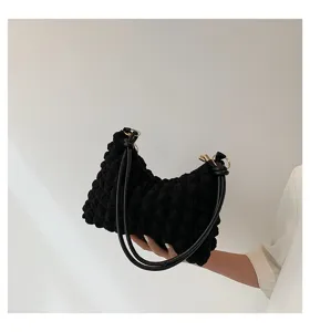 Black pleated cloud shoulder bag underarm style with bubble texture and dual straps.