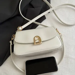 White PU leather small square crossbody bag with elegant metal arch clasp for women.