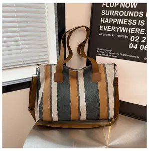 Canvas striped tote bag with brown shoulder strap, casual commuter handbag for women.