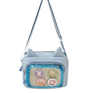 Japanese style cute cat ear crossbody bag with clear window and rabbit pin badges for daily use.
