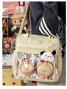 Japanese style PU leather transparent ita bag shoulder bag with cute plush charms for fans.