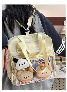 Detailed view of the cute ita backpack with clear front window, plush toys and smooth PU leather.