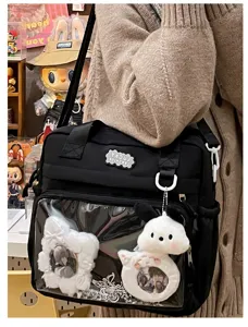 Black ita bag canvas shoulder bag with clear window and cute plush keychain for anime fans.