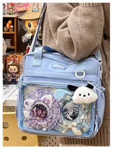 Light blue ita bag cute student backpack transparent window shoulder bag for badges and plushies.