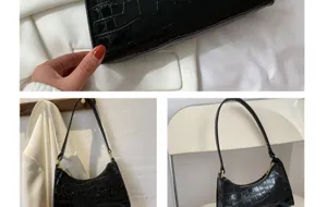 Black textured faux leather underarm shoulder bag close up product detail view.