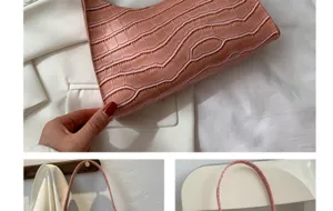 Detailed view of the trendy pink crocodile pattern women underarm baguette shoulder bag.