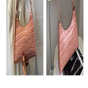Pink crocodile pattern underarm shoulder baguette bag detail view showcase chic style