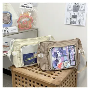 Detailed view of casual canvas ita shoulder bags with clear window for pins and badges, stylish.