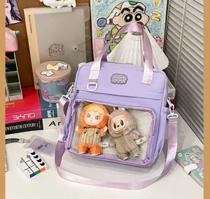 Clear window ita bag detail showing plush dolls display and purple pu backpack design.