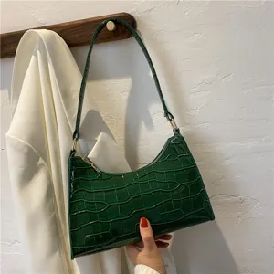 Green crocodile pattern baguette bag for women, stylish leather shoulder underarm handbag.