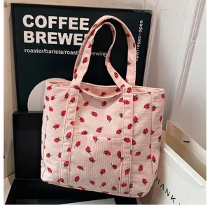 Pink corduroy strawberry print tote bag detail, large capacity casual shoulder bag for women.