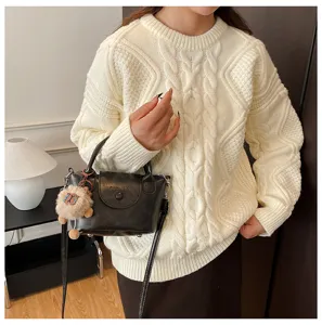 Detailed view of women retro shoulder bag paired with knit sweater for stylish daily commuting wear.