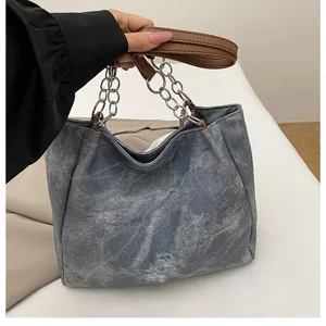 Casual denim tote bag for women, large capacity shoulder bag with metal chain straps.