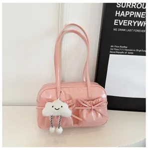 Pink patent leather bowling shoulder bag with cute cloud charm and bow pockets for women.