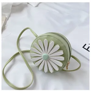 Detail view of a cute round kids PU leather crossbody bag featuring white daisy flower decor.