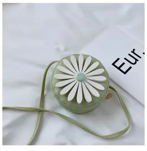 Detailed close up view of the green round kids shoulder bag with white daisy flower detail.