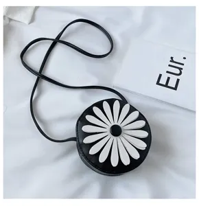 Black and white round PU kids crossbody bag featuring a 3D cute white daisy detail.