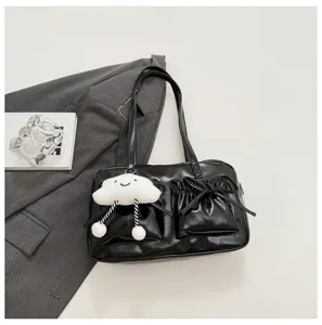 Black bowling shoulder bag for women, featuring chic bow pockets and a cute cloud pendant.