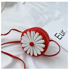 Cute red round children cross body bag with white 3d daisy flower PU leather detail.