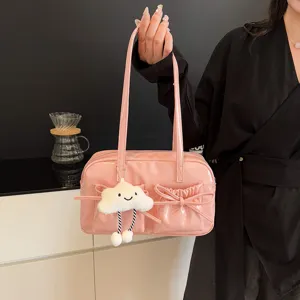 Pink patent leather bowling shoulder bag with cute cloud pendant and bowknot front pockets.