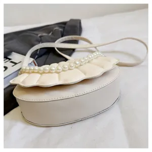 White shell shoulder bag for women, stylish pearl decorated crossbody bag with elegant design.