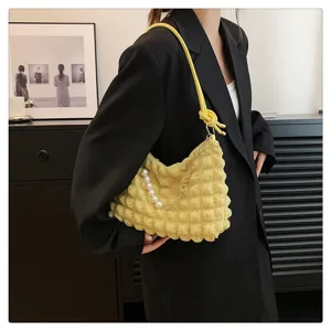 Yellow ruched cloud shoulder bag with pearl chain detail, stylish everyday accessory.