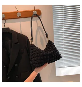 Black pleated shoulder bag for women, stylish cloud underarm bag with chic textured design.