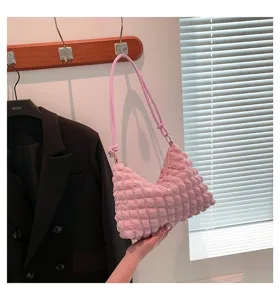 Pink puckered shoulder bag detail, textured cloud dumpling bag closeup showing soft fabric.