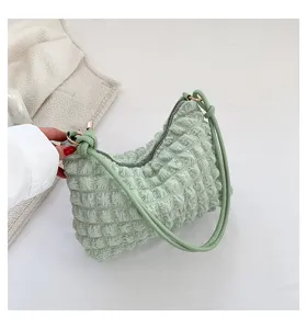 Green crinkled underarm shoulder bag detailed view, trendy fashion cloud bag for women daily.