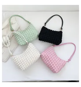 Detailed view of trendy puffy crinkled shoulder bags in multi colors for stylish women daily.