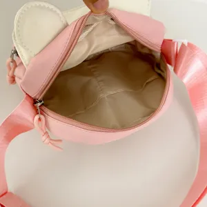 Cute pink white crossbody bag detail, cute ear design, adjustable shoulder strap interior view