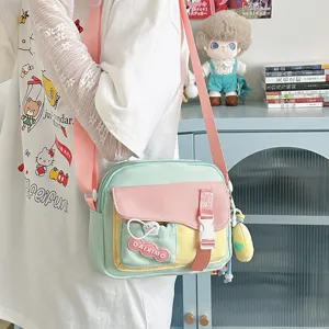 Cute pastel canvas crossbody bag with multi-color block design, ideal for daily and casual wear.