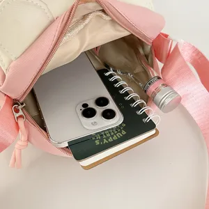 Cute pink and white casual crossbody shoulder bag for women, perfect for summer daily outings.