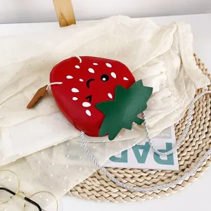 Cute red strawberry shape children crossbody bag with lovely cartoon face and shoulder strap.