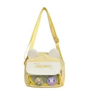 Cute yellow canvas ita bag with bunny ears, white flap, and front mesh window for pins.