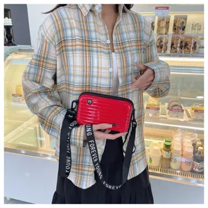Mini suitcase crossbody bag for women, stylish hardshell shoulder bag with letter strap.